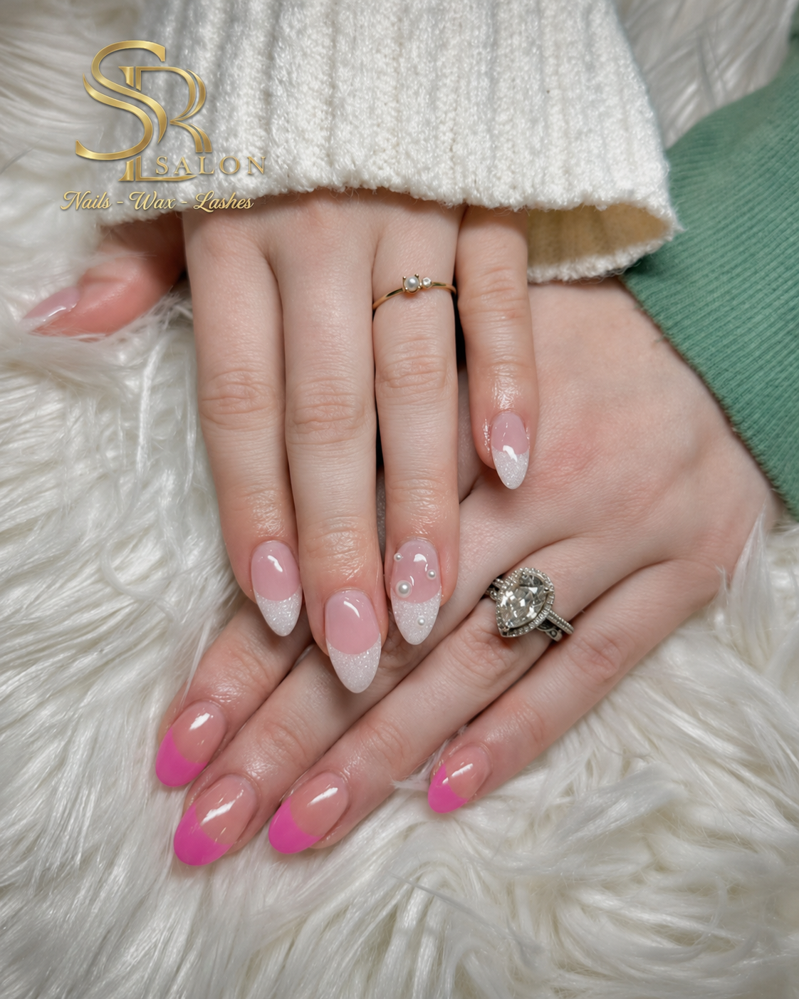 Almond nails with sheer nude base, silver glitter French tips, pearl embellishments, and hot pink accent tips.