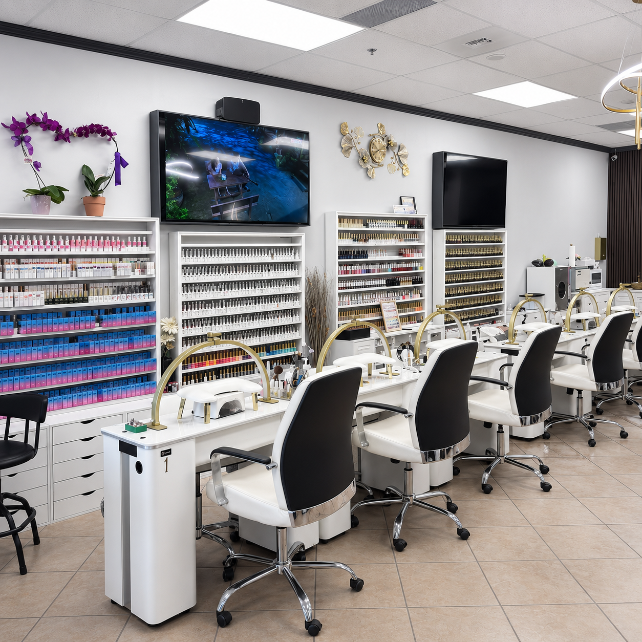 Manicure stations at SB Salon with a wall of nail polish colors.